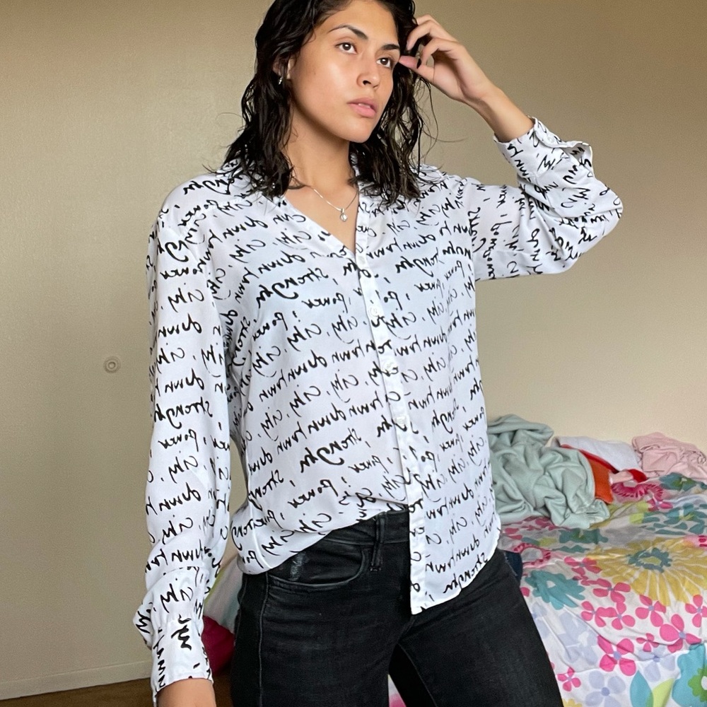 White blouse with black writing